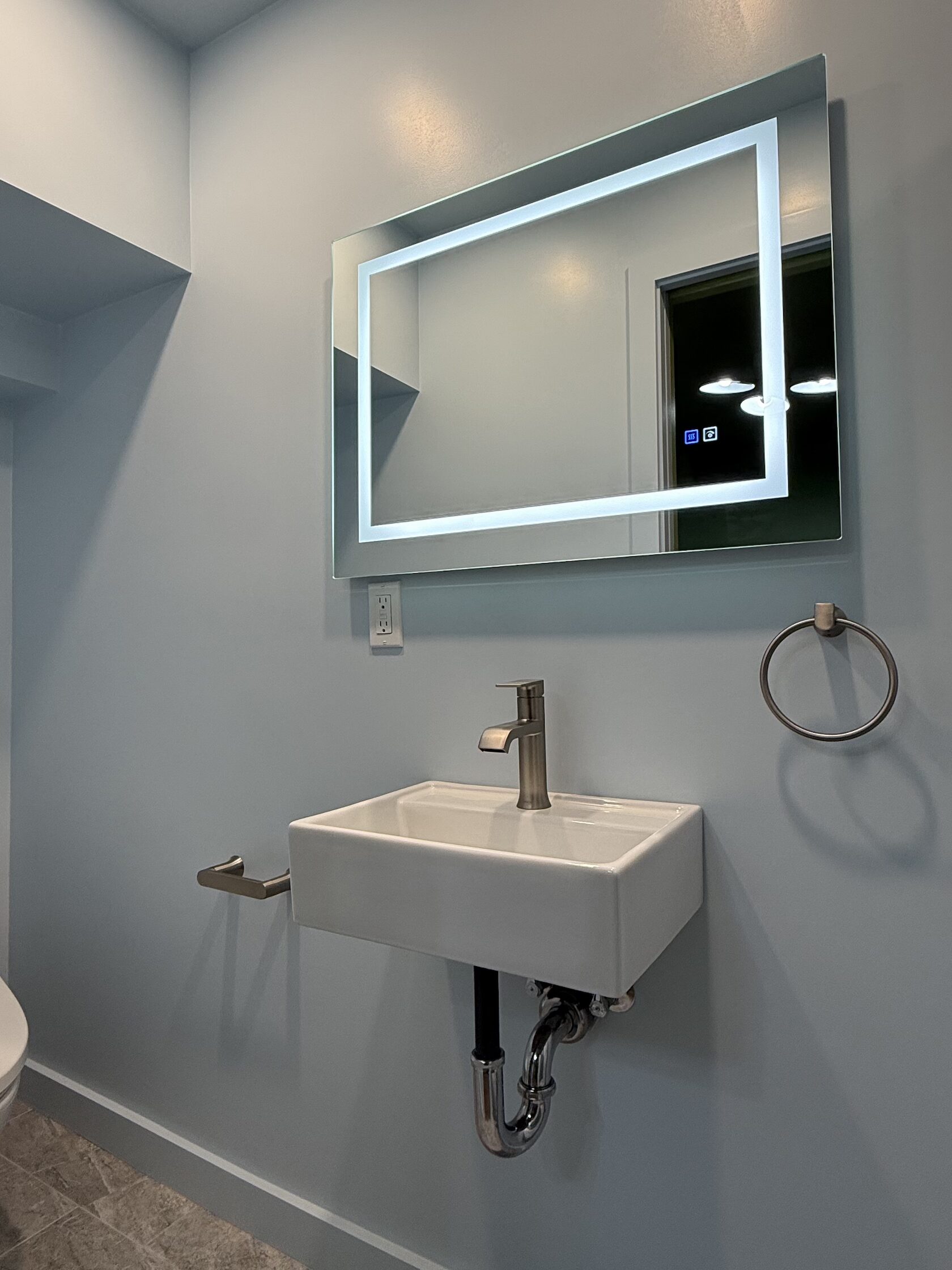 Modern bathroom remodel by HER Construction